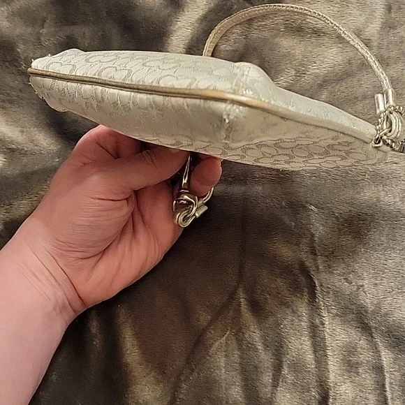 Elegant Coach White and Silver Wristlet